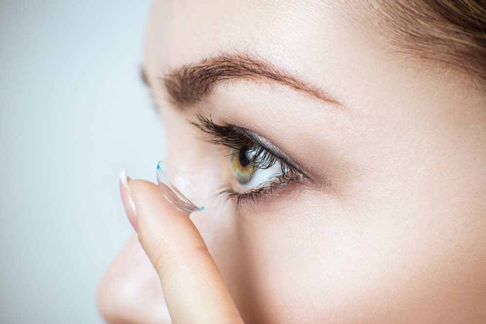 Close-up Shot Of Woman Wearing Contact Lens