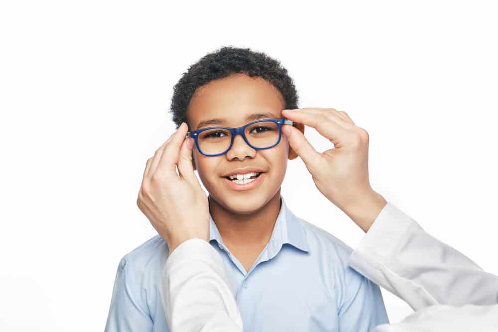 kid with eyeglasses smiling