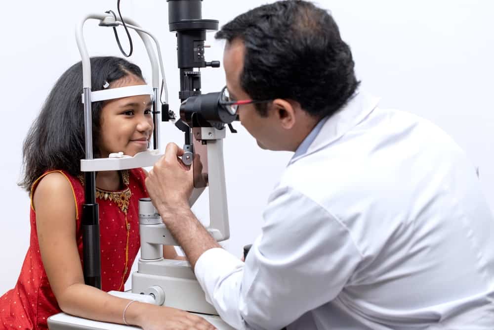 Girl And Optometrist Doing Eye Test