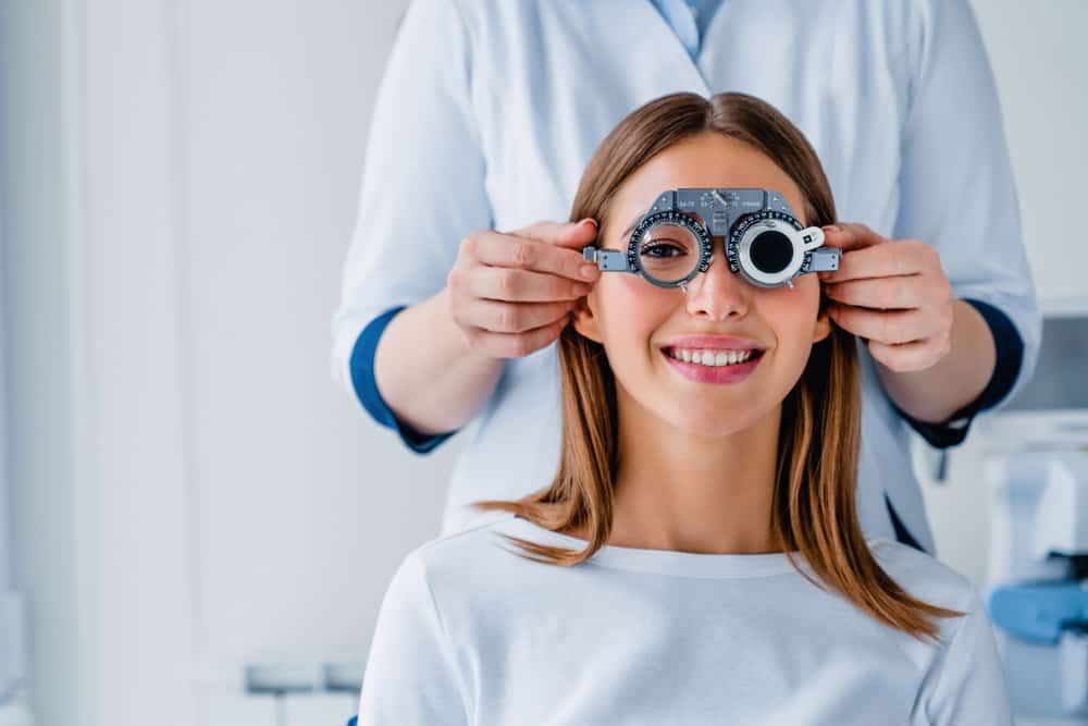 woman smiling getting an eye test